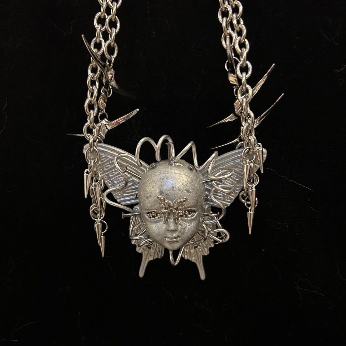 Cyberpunk Silver Metallic Butterfly Doll Face Necklace - Wire Wrapped & Spiked Chains - Crux Jewelry product image 1