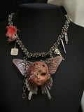 Holographic Pink Butterfly Injured Doll Necklace - Syringe & Revolver Charms - Crux Jewelry product image 1