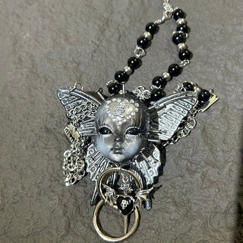 Silver Metallic Butterfly Doll Face Necklace with Rhinestone Heart & Winged Skull Charm - Crux Jewelry product image 4