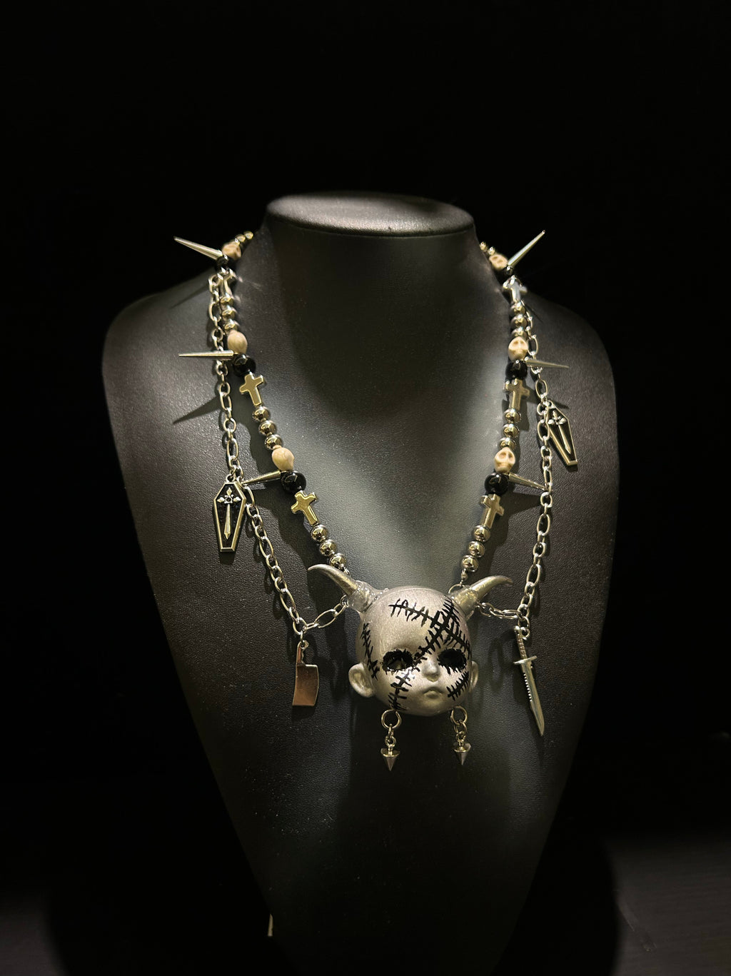 Silver Horned Stitched Doll Face Necklace with Cleaver, Knife & Coffin Charms - Crux Jewelry product image 2
