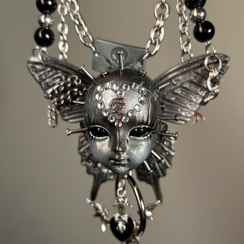 Silver Metallic Butterfly Doll Face Necklace with Rhinestone Heart & Winged Skull Charm - Crux Jewelry product image 6