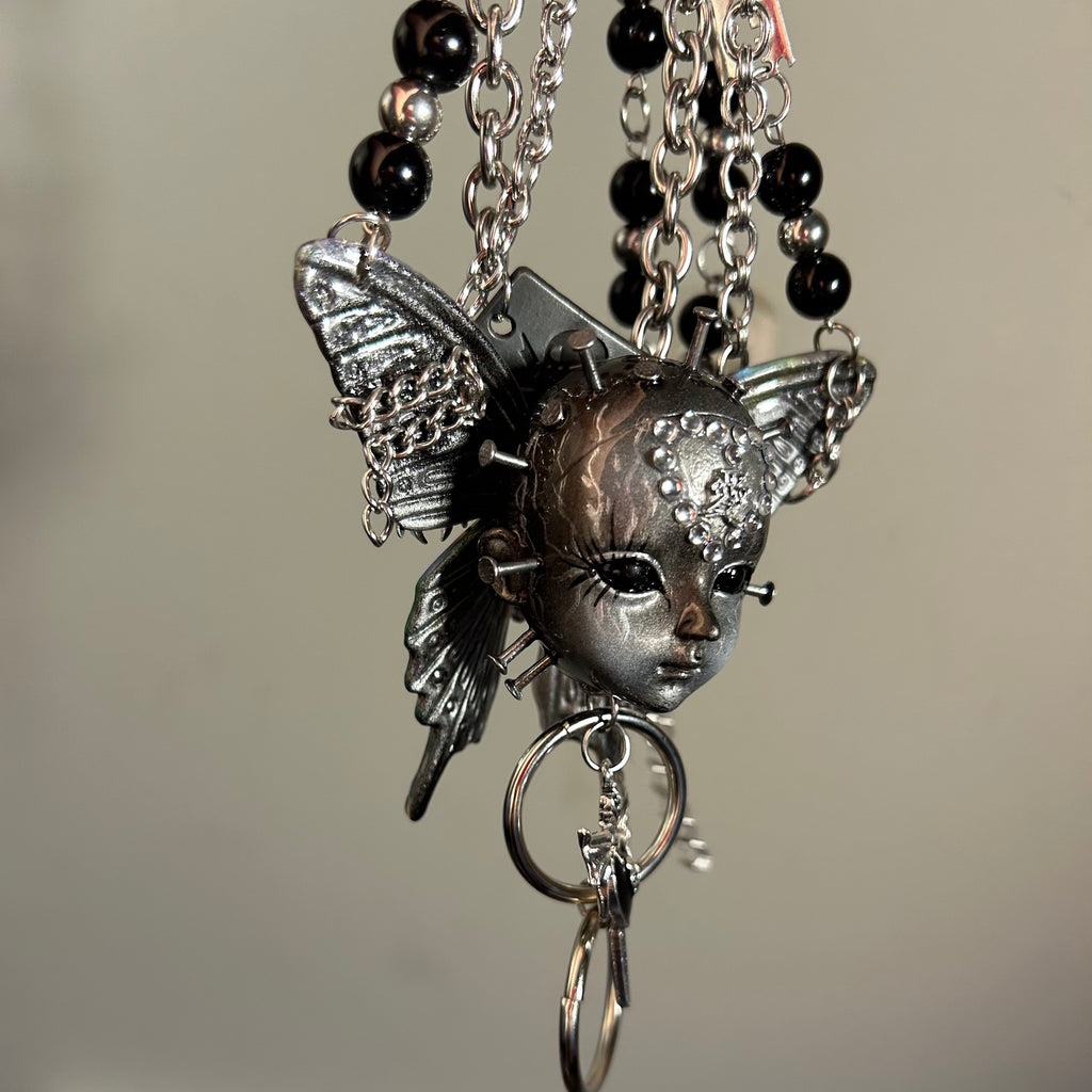 Silver Metallic Butterfly Doll Face Necklace with Rhinestone Heart & Winged Skull Charm - Crux Jewelry product image 8