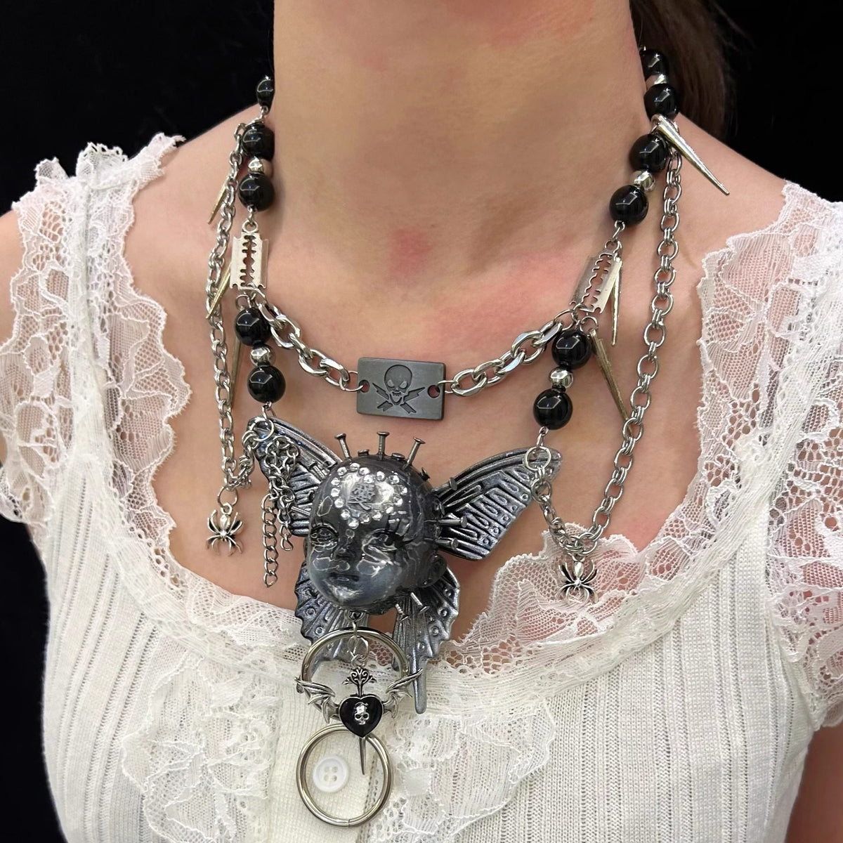 Silver Metallic Butterfly Doll Face Necklace with Rhinestone Heart & Winged Skull Charm product image 2