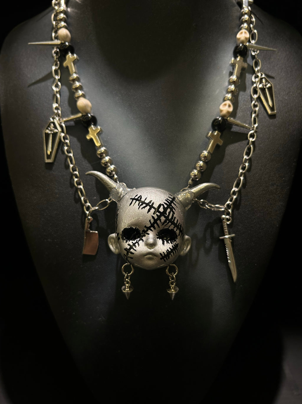 Silver Horned Stitched Doll Face Necklace with Cleaver, Knife & Coffin Charms - Crux Jewelry product image 4