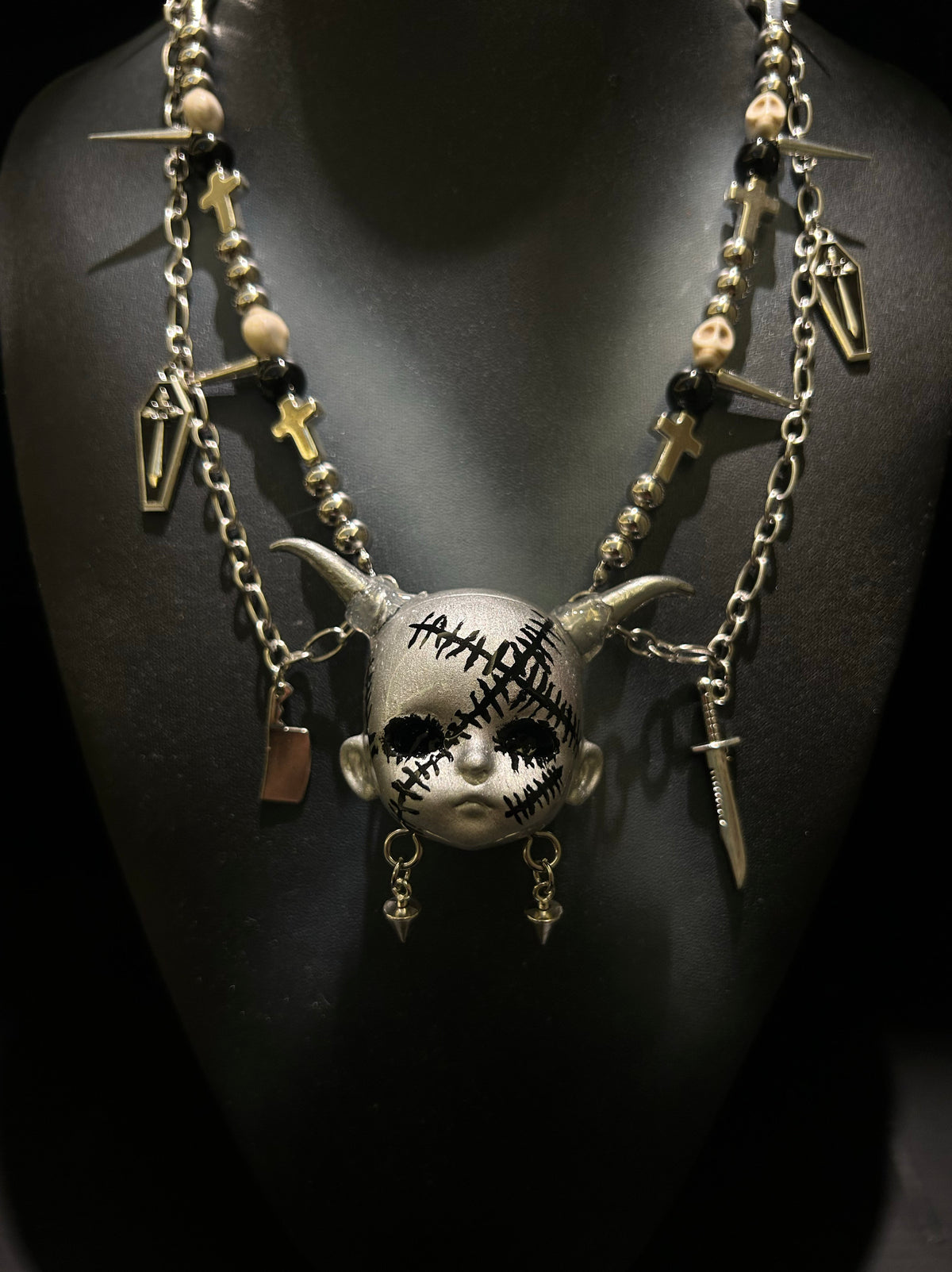 Silver Horned Stitched Doll Face Necklace with Cleaver, Knife & Coffin Charms - Crux Jewelry product image 4