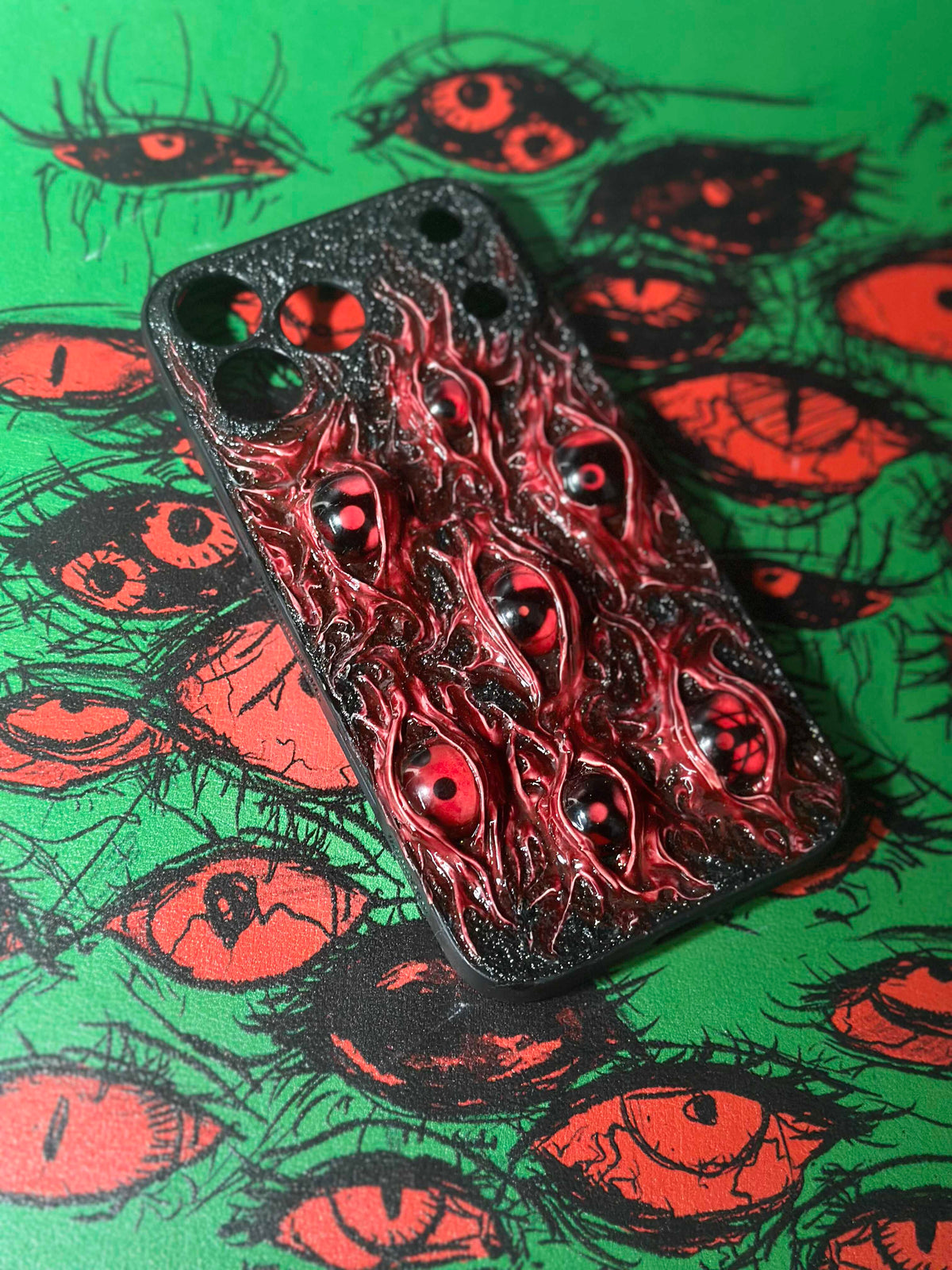Uchiha Nightmare: Handmade Red Flesh Case with Multiple Sharingan Eyes (3D Texture) - Crux Jewelry product image 5