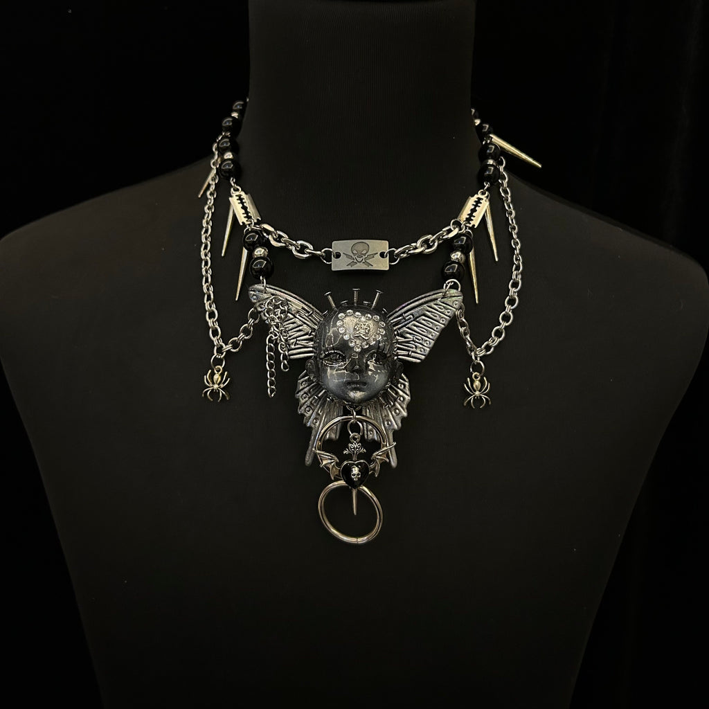 Silver Metallic Butterfly Doll Face Necklace with Rhinestone Heart & Winged Skull Charm - Crux Jewelry product image 2