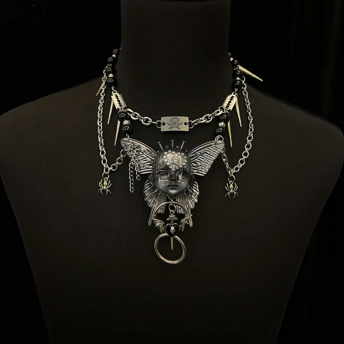 Silver Metallic Butterfly Doll Face Necklace with Rhinestone Heart & Winged Skull Charm - Crux Jewelry product image 2