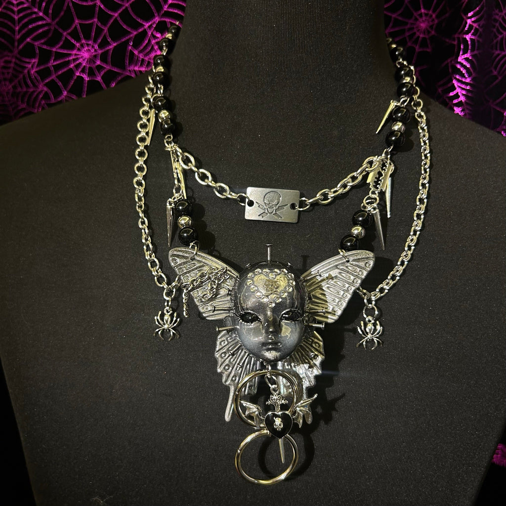 Silver Metallic Butterfly Doll Face Necklace with Rhinestone Heart & Winged Skull Charm - Crux Jewelry product image 10