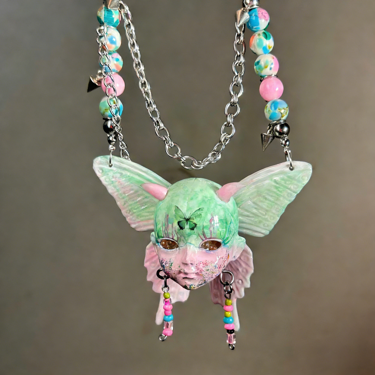 Pastel Goth Green Moth Doll Face Necklace with Pink Horns & Candy Beads - Crux Jewelry product image 1