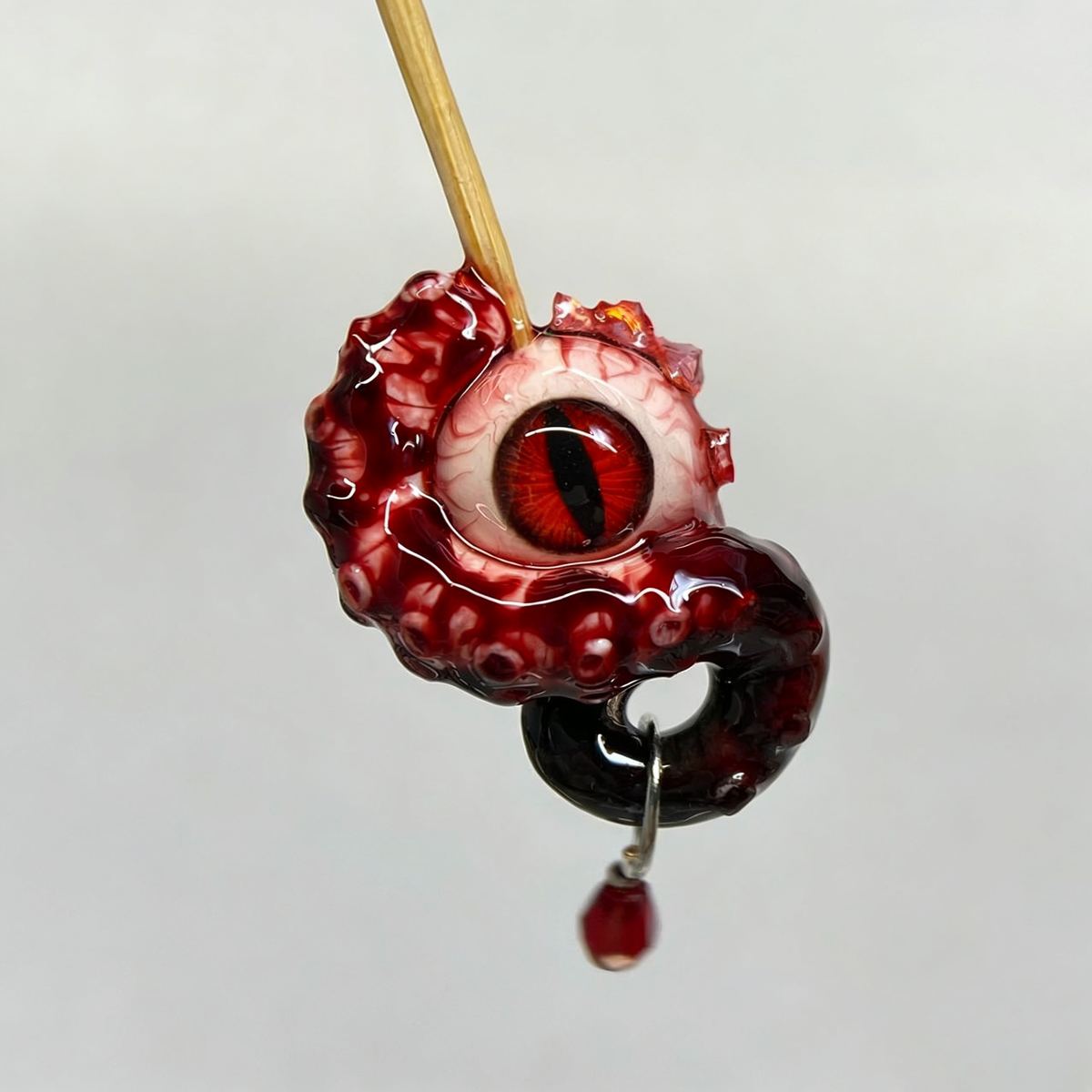 Cthulhu Eye – Vertical Pupil Octopus Tentacle Earrings in Deep Red - Crux Jewelry product image 1