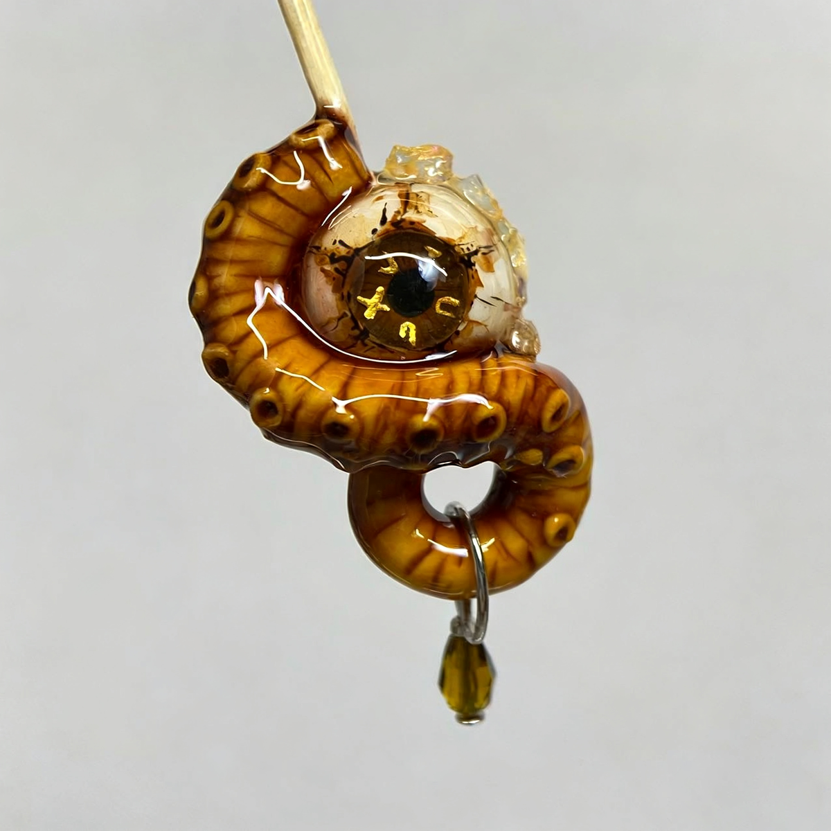 Amber Abyssal Eye Octopus Tentacle Earring - Crux Jewelry product image 1