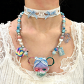 Sweet Lolita Pastel Doll Face Necklace with Rainbow & Blue Gingham Bows - Crux Jewelry product image 1
