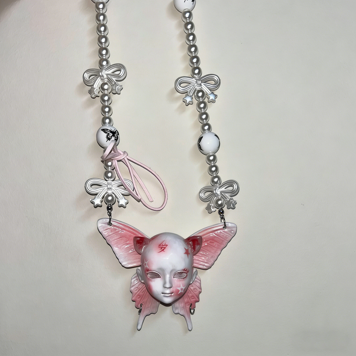 Coquette Pink Butterfly Doll Face Pearl Necklace with Silver Bows & Ribbons - Crux Jewelry product photo