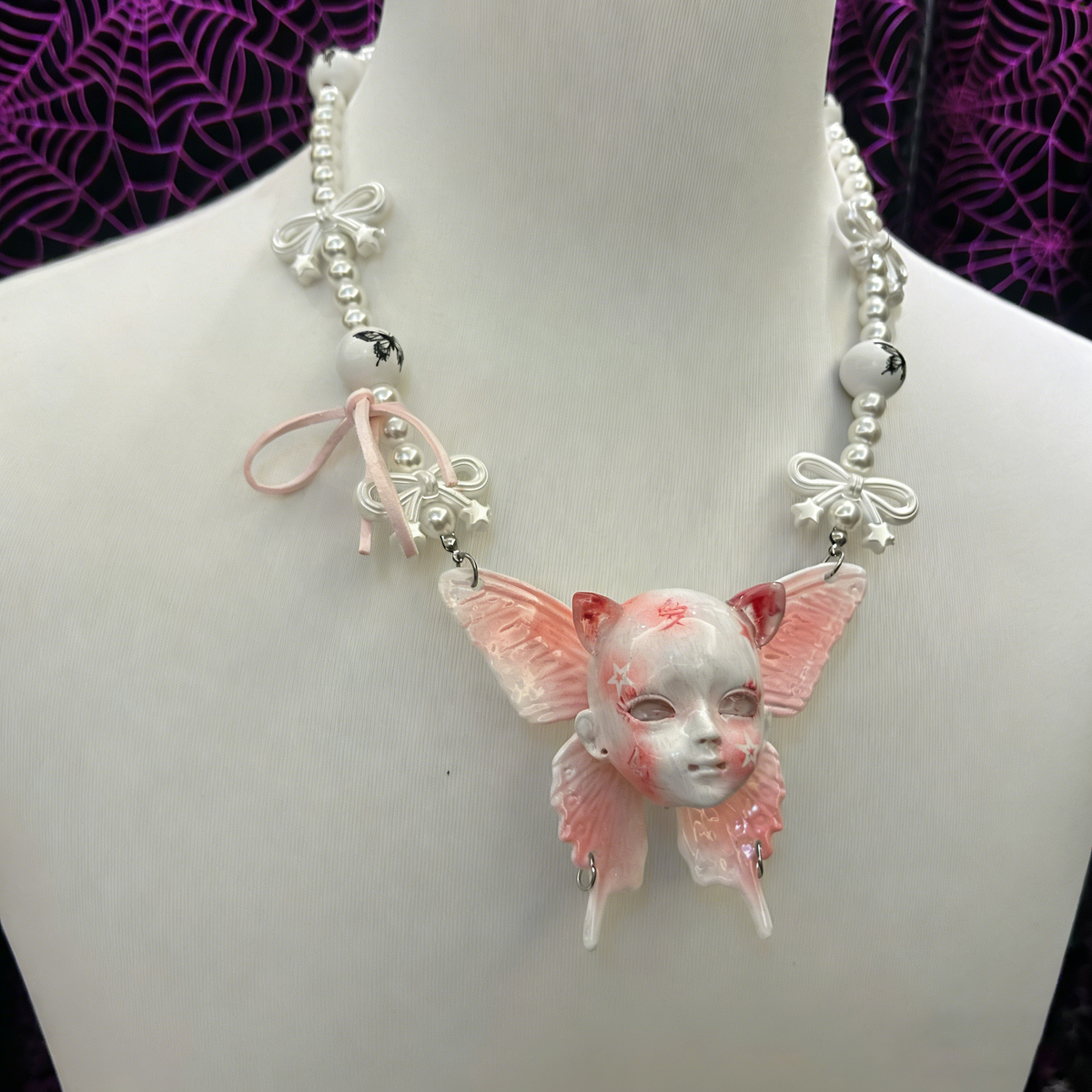 Coquette Pink Butterfly Doll Face Pearl Necklace with Silver Bows & Ribbons - Crux Jewelry product photo