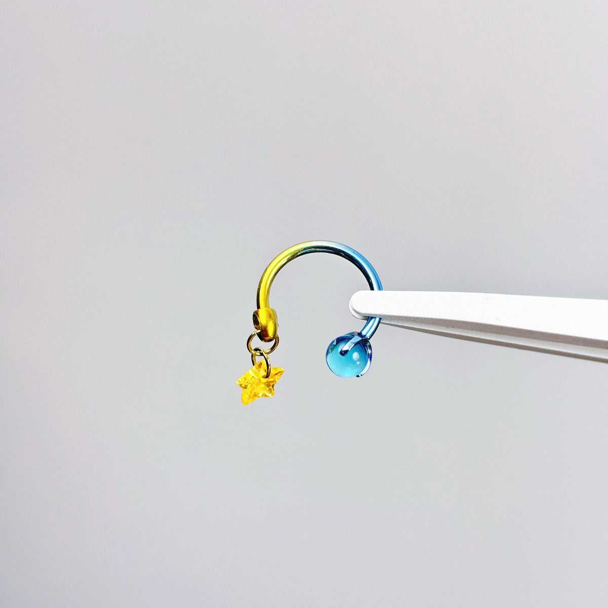 Celestial Dangle Star Titanium Horseshoe Ring detail 5